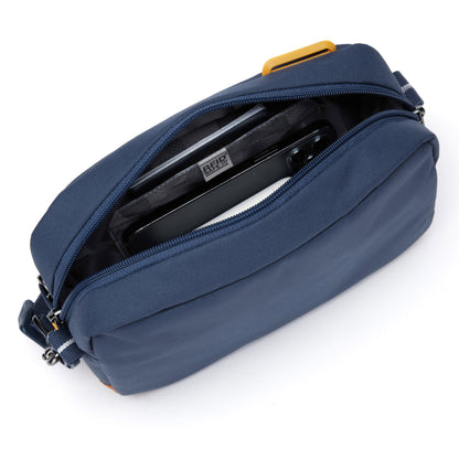 Pacsafe® GO Anti-Theft Crossbody Bag in coastal blue colour showing interior with a RFID blocking pocket.