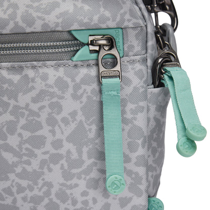 Close-up of a Pacsafe® GO Anti-Theft Crossbody Bag in gray with aqua zippers and a front pocket.