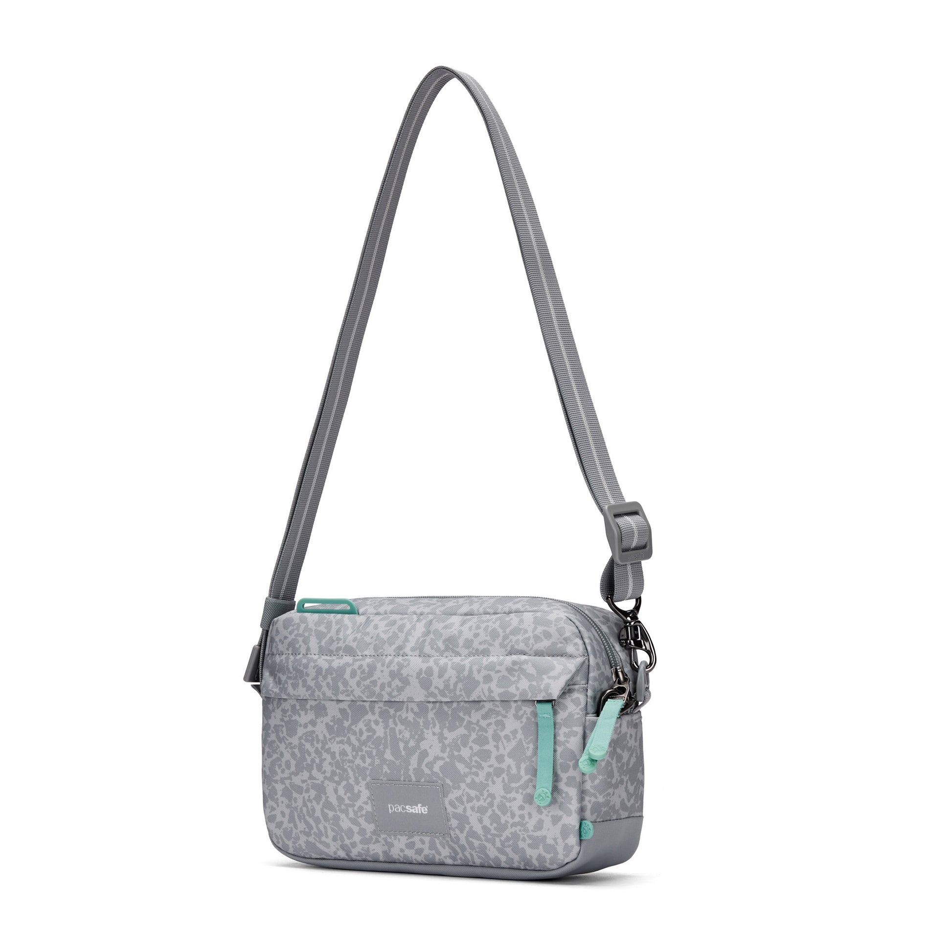 Pacsafe® GO Anti-Theft Crossbody Bag by Pacsafe; gray with animal print, teal zips & RFID blocking pocket.