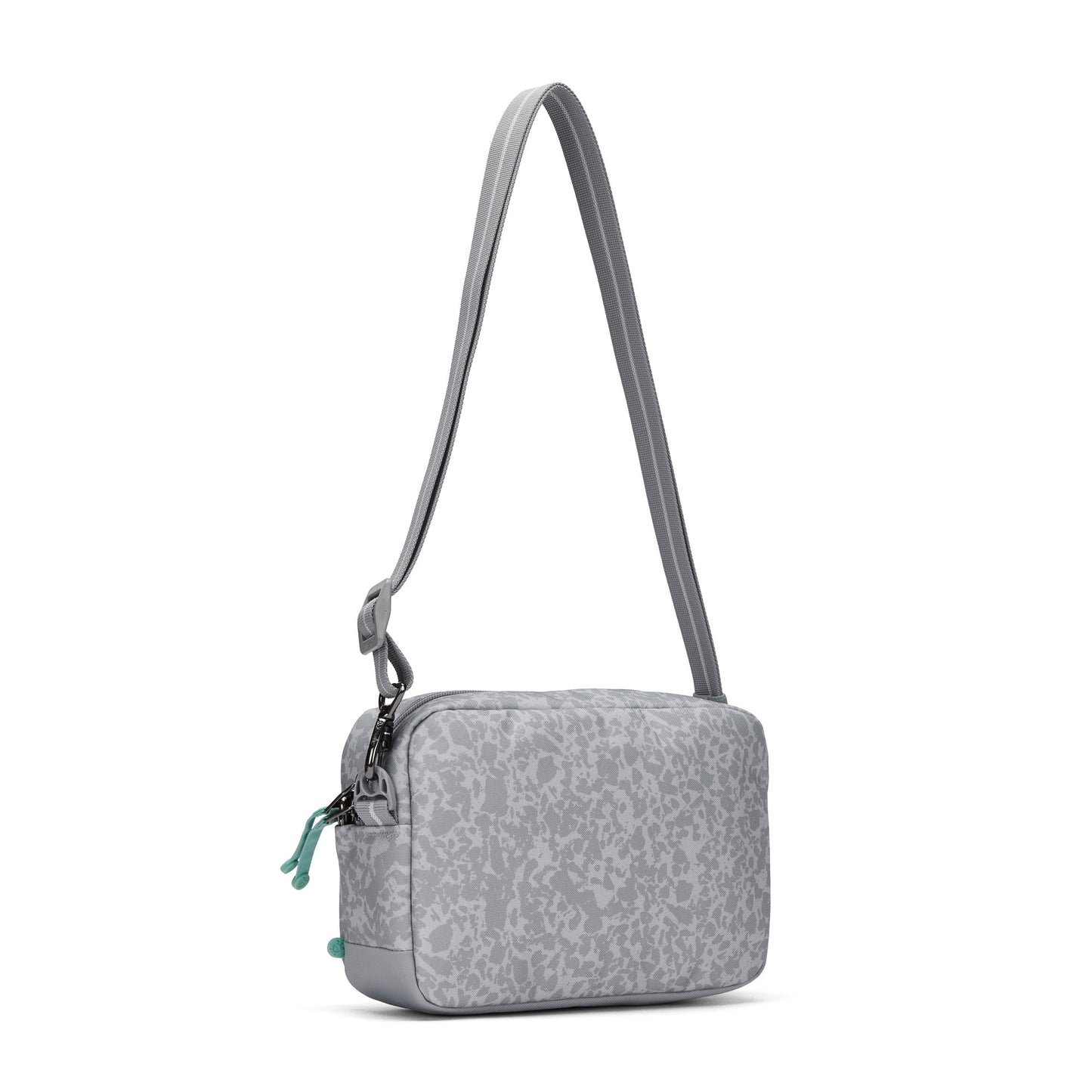 Pacsafe® GO Anti-Theft Crossbody Bag in light gray recycled polyester with abstract pattern, adjustable strap.