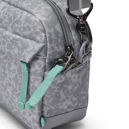 Close-up of the Pacsafe® GO Anti-Theft Crossbody Bag in gray with teal zipper pulls and a metal strap clasp.