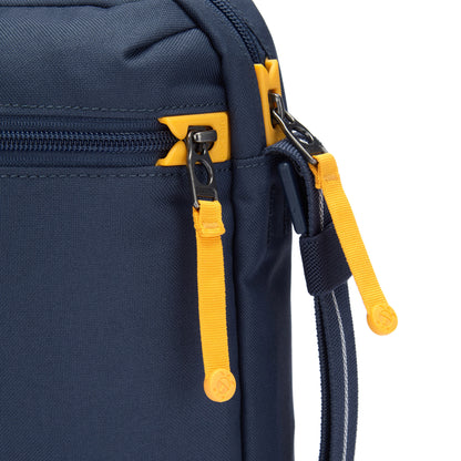 Close up of yellow zipper pulls and lockable zippers on the coastal blue Pacsafe® GO Anti-Theft Festival Crossbody