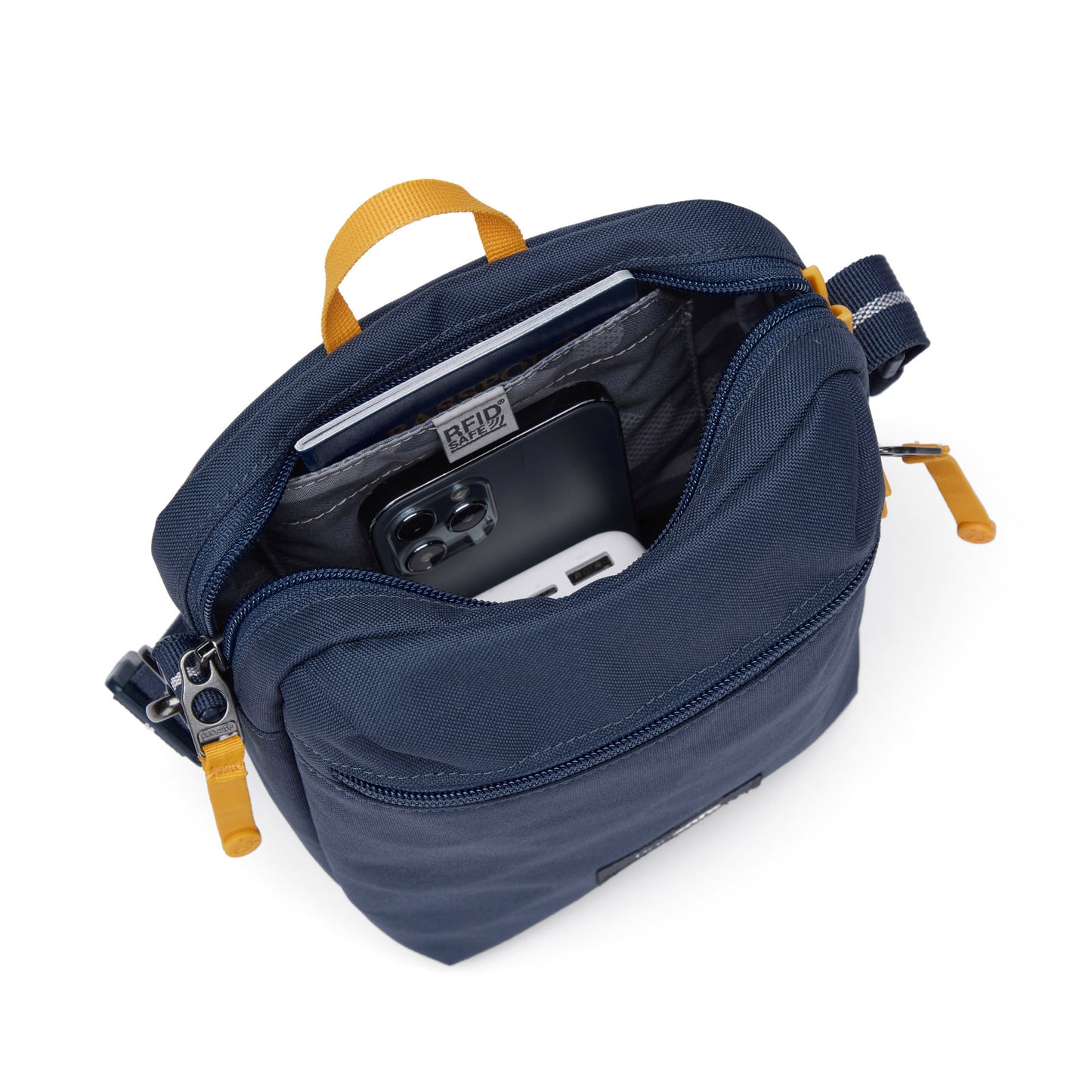 Pacsafe® GO Anti-Theft Festival Crossbody in coastal blue colour, top view with zipper open showing bag interior and RFID blocking pocket.