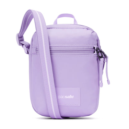 The Pacsafe® GO Anti-Theft Micro Crossbody is a small lavender bag with front zipper and adjustable strap.
