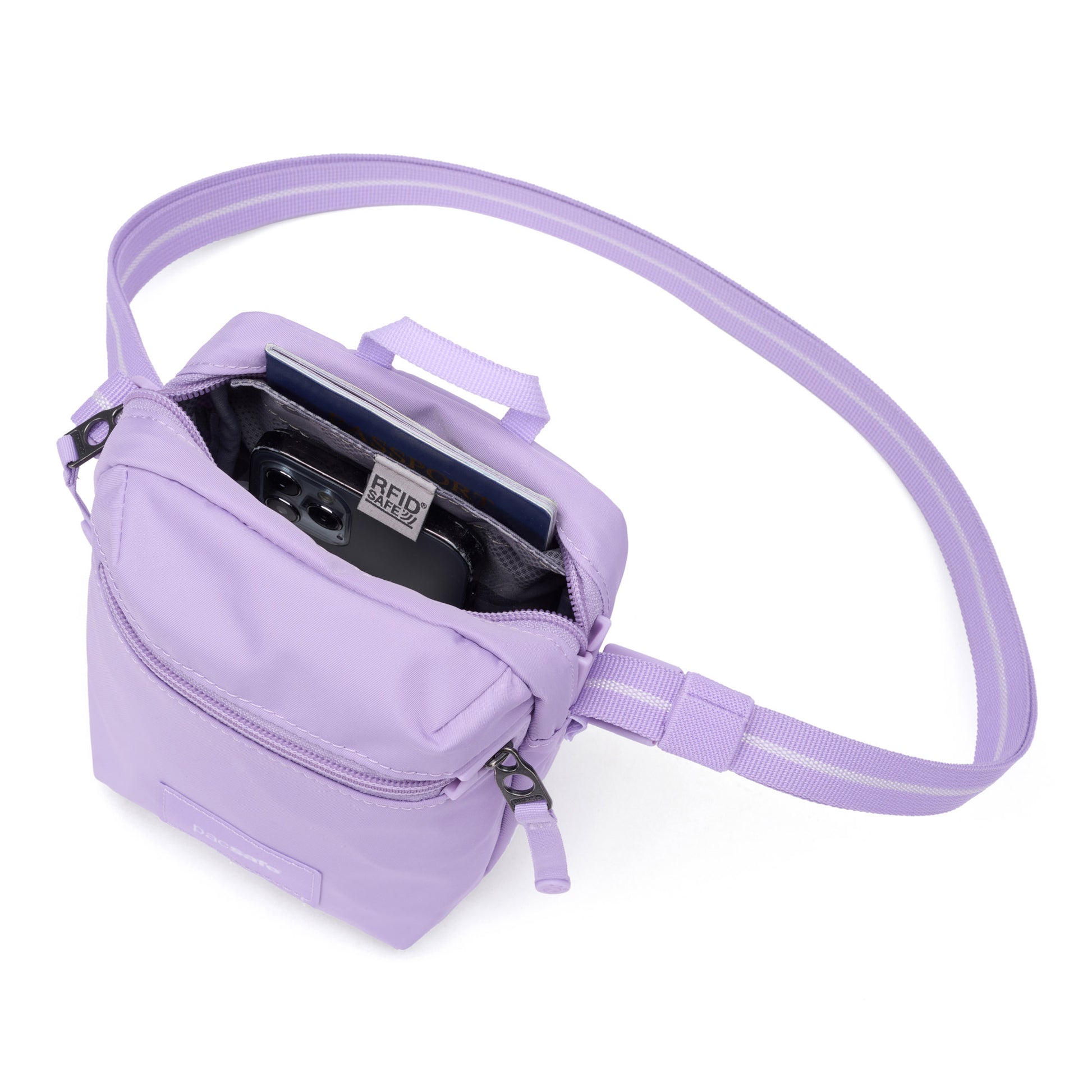 The Pacsafe® GO Anti-Theft Micro Crossbody by Pacsafe in lavender fits a phone, notebook & pen in its main compartment.