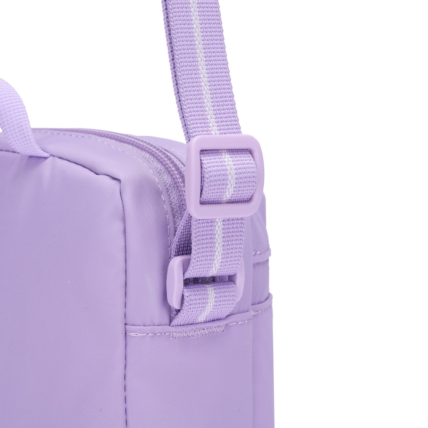 Close-up of the Pacsafe® GO Anti-Theft Micro Crossbody in lavender, highlighting strap, buckle, and zipper.
