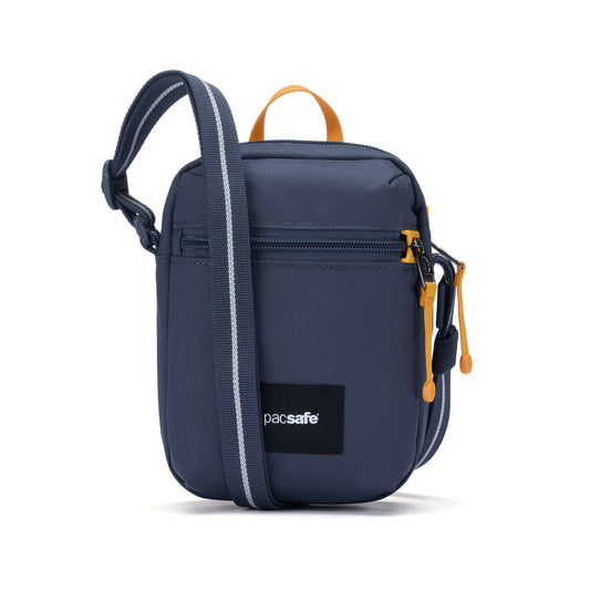 Product Image – The Pacsafe® GO Anti-Theft Micro Crossbody is blue, small, with yellow zippers and a black adjustable strap.