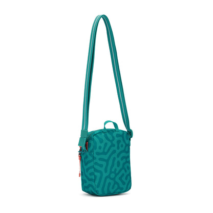 Pacsafe® GO Anti-Theft Micro Crossbody: teal, abstract pattern, RFID pocket, zip closure, adjustable strap.