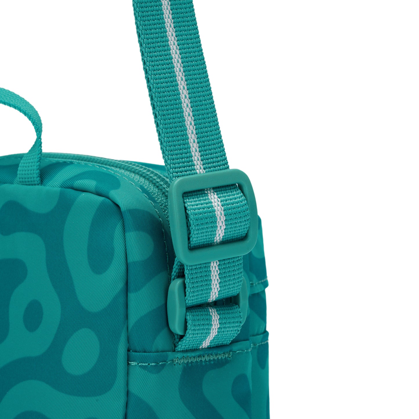 Pacsafe® GO Anti-Theft Micro Crossbody in teal with RFID-blocking pocket and adjustable strap, by Pacsafe.