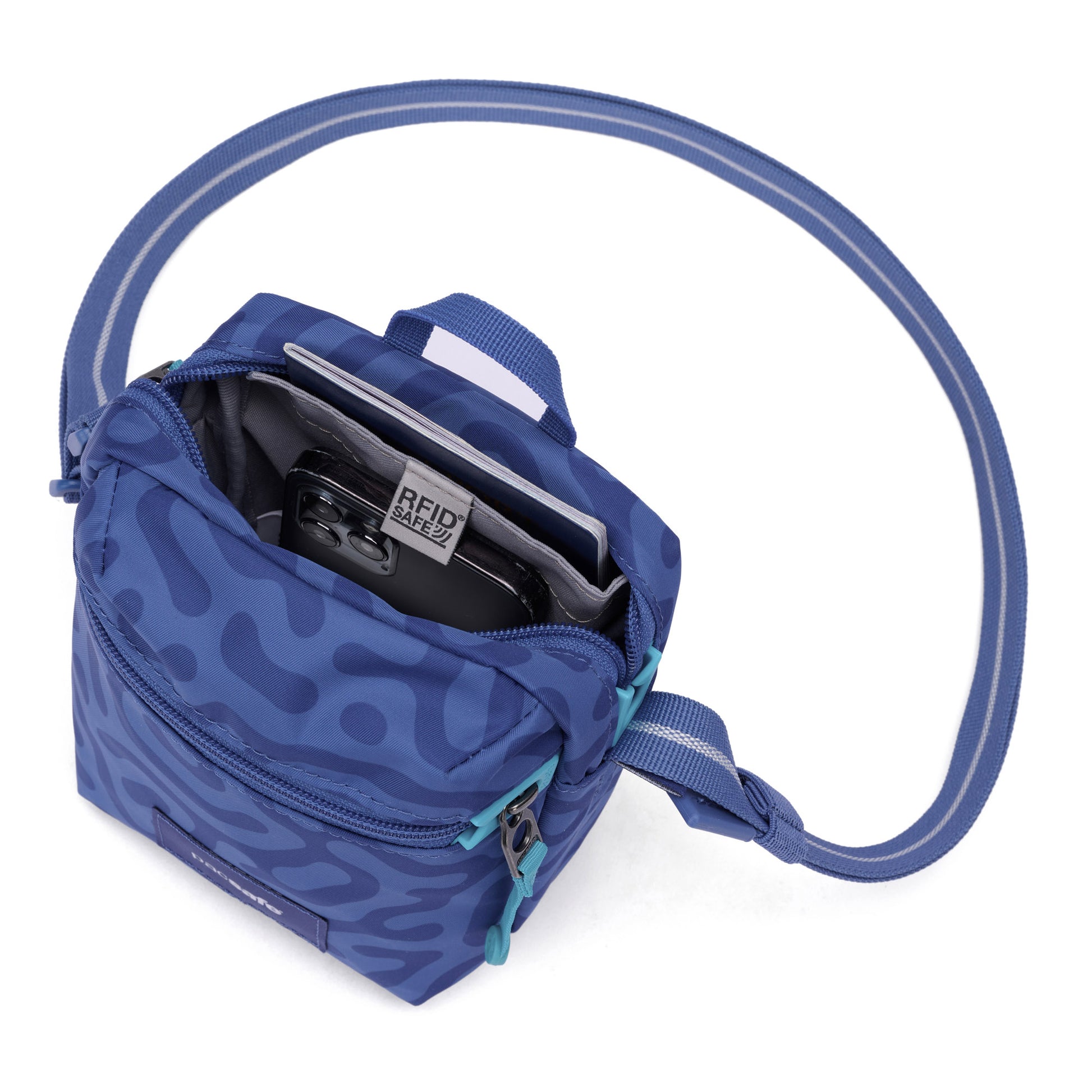 The Pacsafe® GO Anti-Theft Micro Crossbody in blue recycled polyester fits a phone and card case, viewed from above.