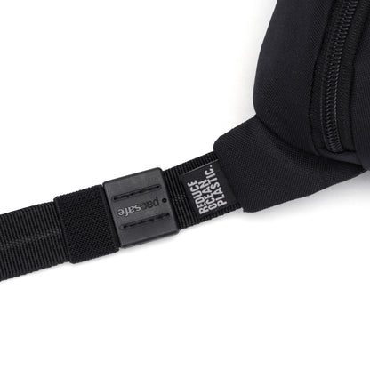 Close-up of the Pacsafe® GO Anti-Theft Micro Sling's black strap with plastic buckle, made from recycled polyester.