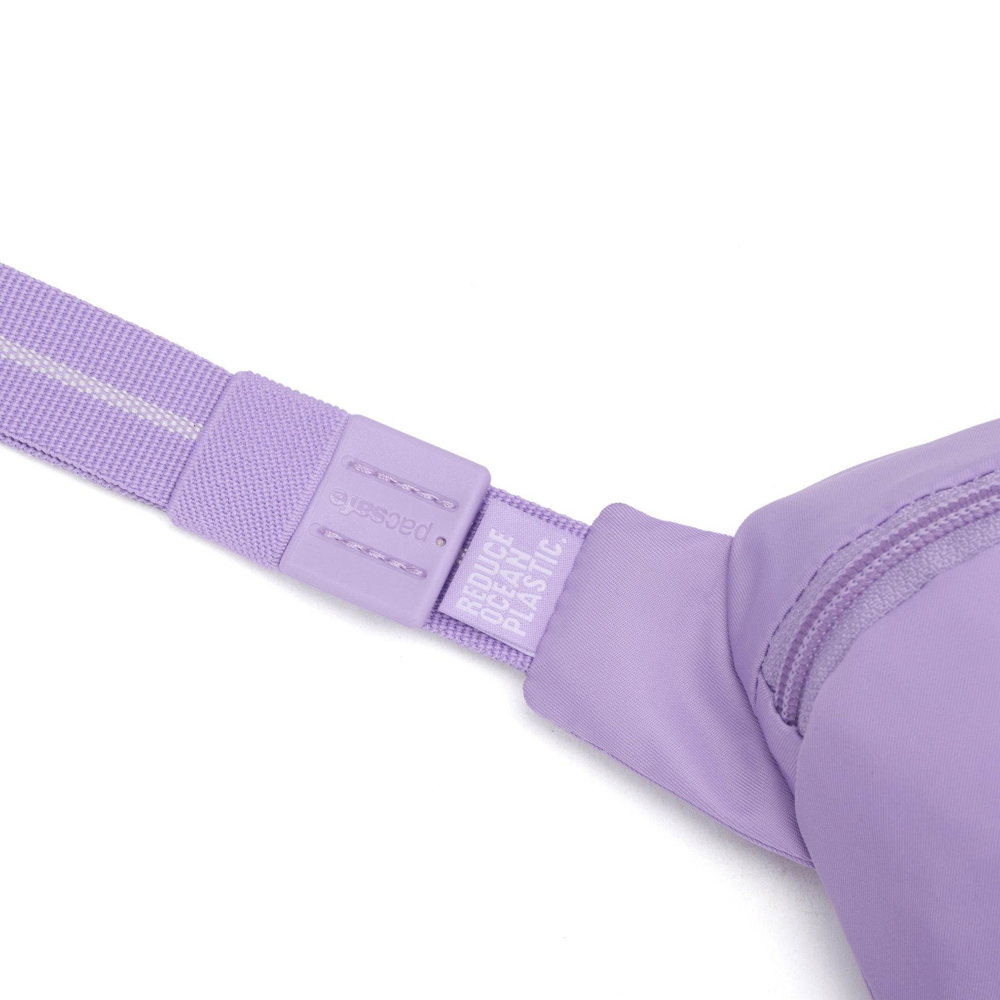 Close-up of the Pacsafe® GO Anti-Theft Micro Sling in lavender, made from recycled polyester.