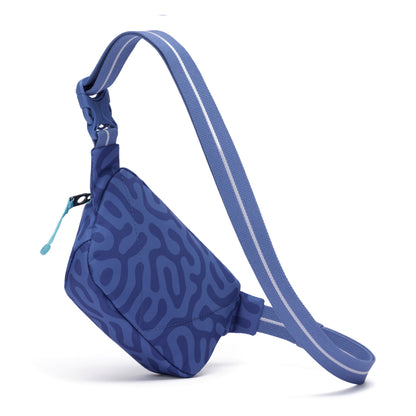 The Pacsafe® GO Anti-Theft Micro Sling by Pacsafe is blue with abstract waves and a zippered main compartment.