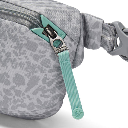 Close-up of the Pacsafe® GO Anti-Theft Micro Sling in gray with teal zipper, buckle, and recycled polyester.
