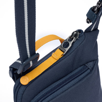 Close up of lockable zipper pull on coastal blue Pacsafe® GO Anti-Theft Tech Crossbody