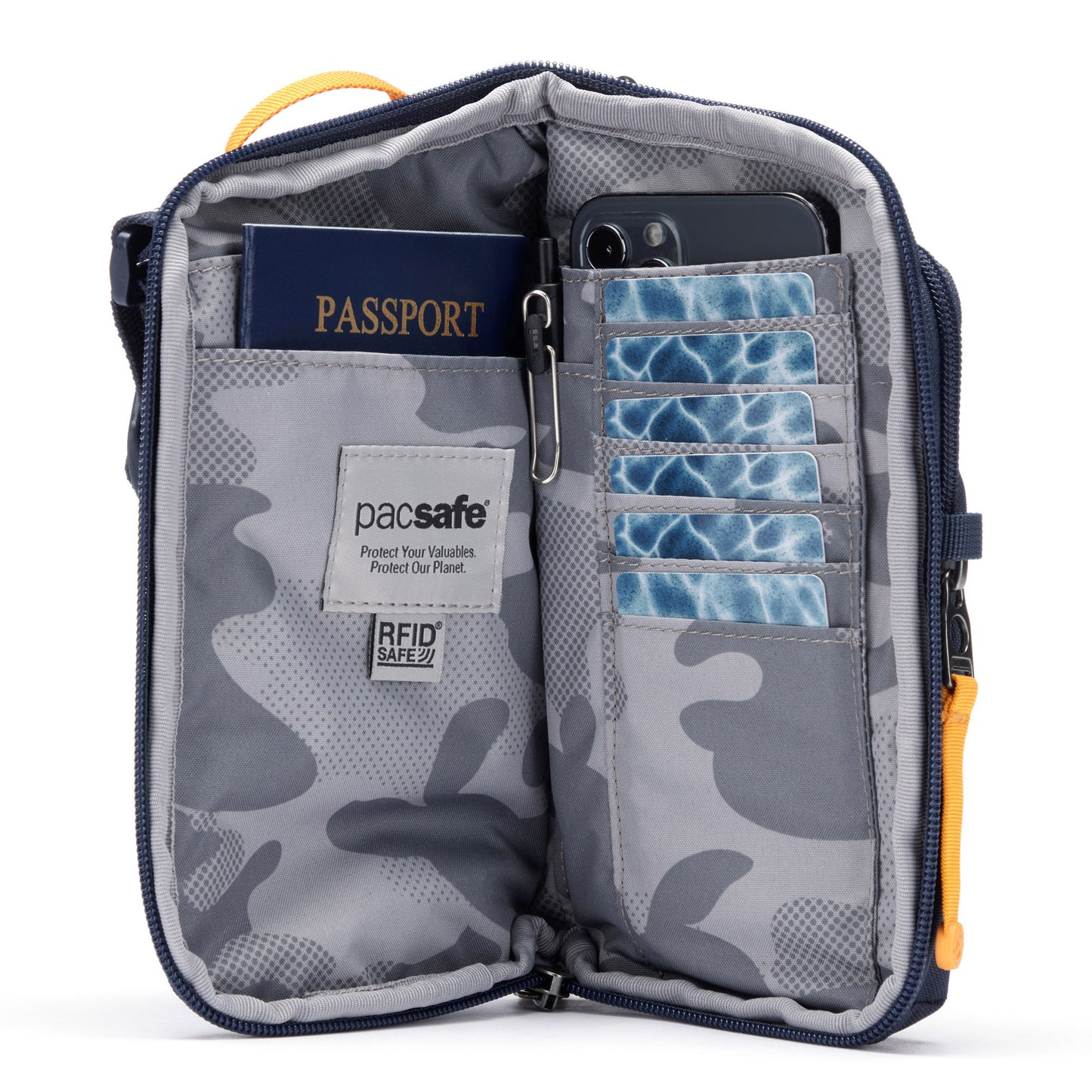 Pacsafe® GO Anti-Theft Tech Crossbody in coastal blue colour unzipped showing interior pockets that includes a RFID blocking pocket, mobile phone, passport and credit card pockets.