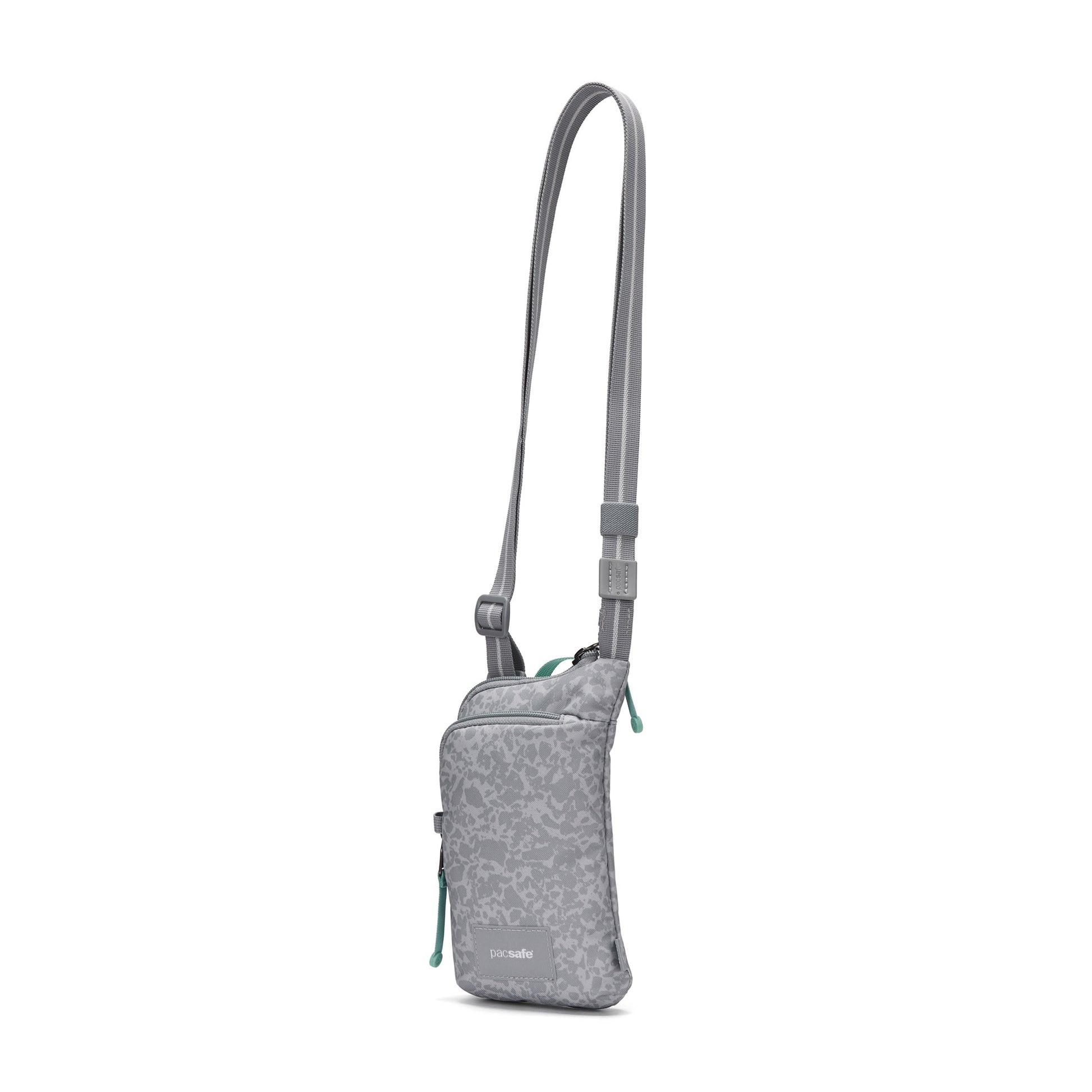Pacsafe® GO Anti-Theft Tech Crossbody: RFID-secure, adjustable strap, front zip pocket, subtle pattern.