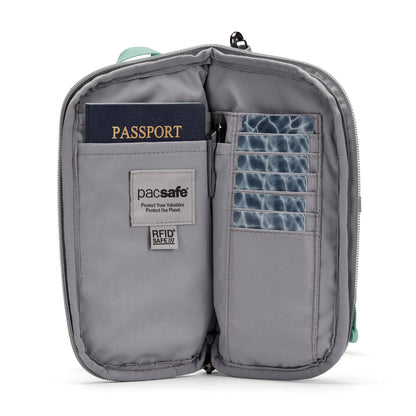 Open Pacsafe® GO Anti-Theft Tech Crossbody showing a passport, six cards, and “RFID SAFE” on the label.