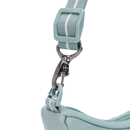 Close up of turn n lock clip on strap of fresh mint Pacsafe® GO Anti-Theft Lunar Crossbody