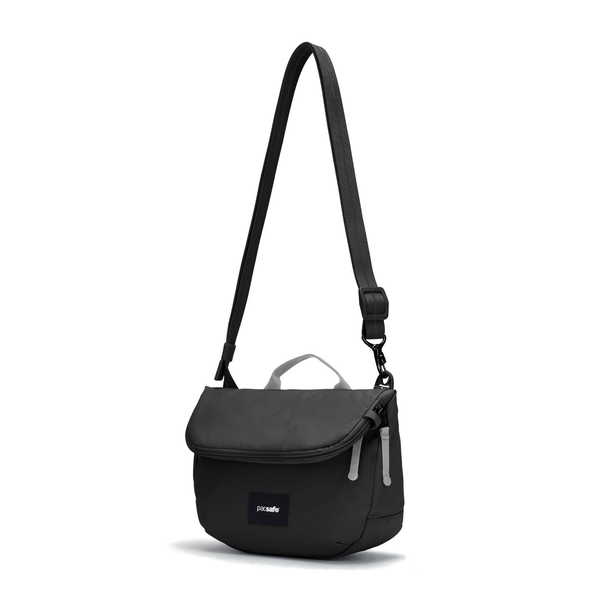 The Pacsafe® GO Anti-Theft Saddle Crossbody is a black, recycled polyester bag with flap and adjustable strap.