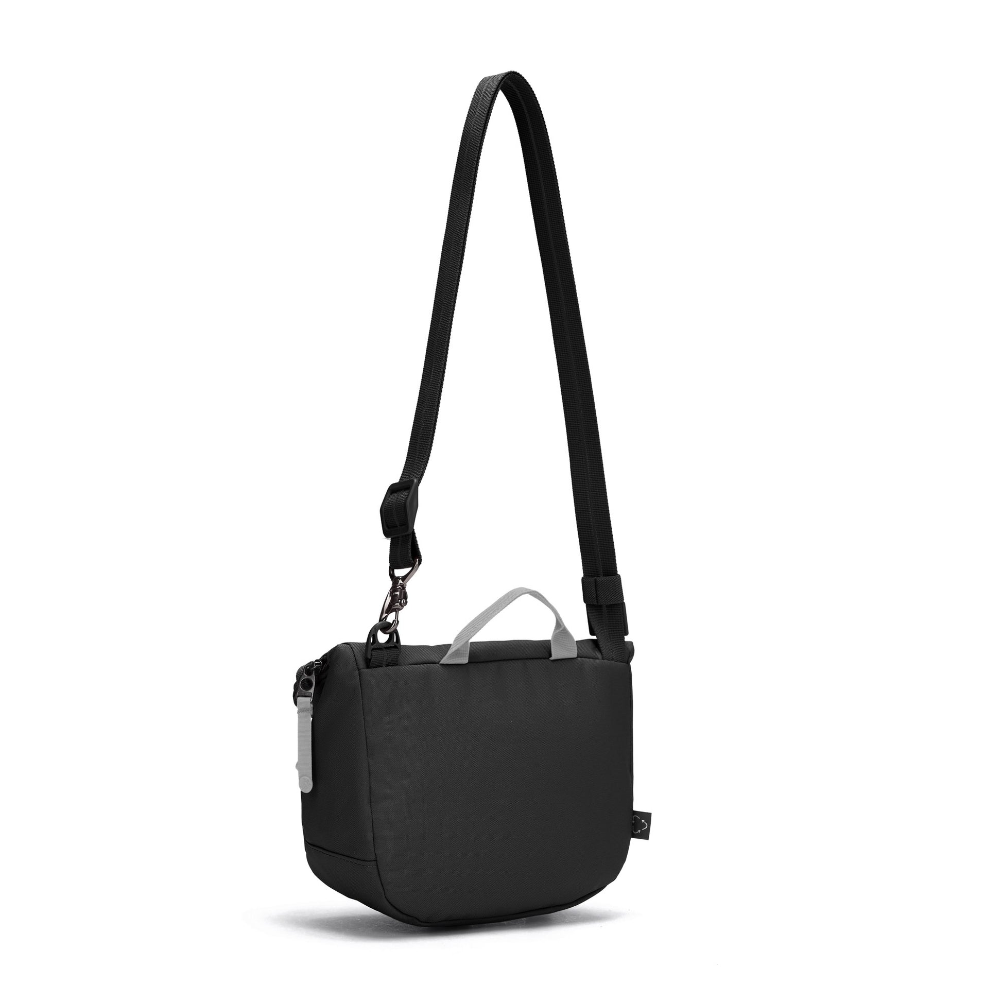 The Pacsafe® GO Anti-Theft Saddle Crossbody, by Pacsafe, is a small black bag with an adjustable strap and top handle.
