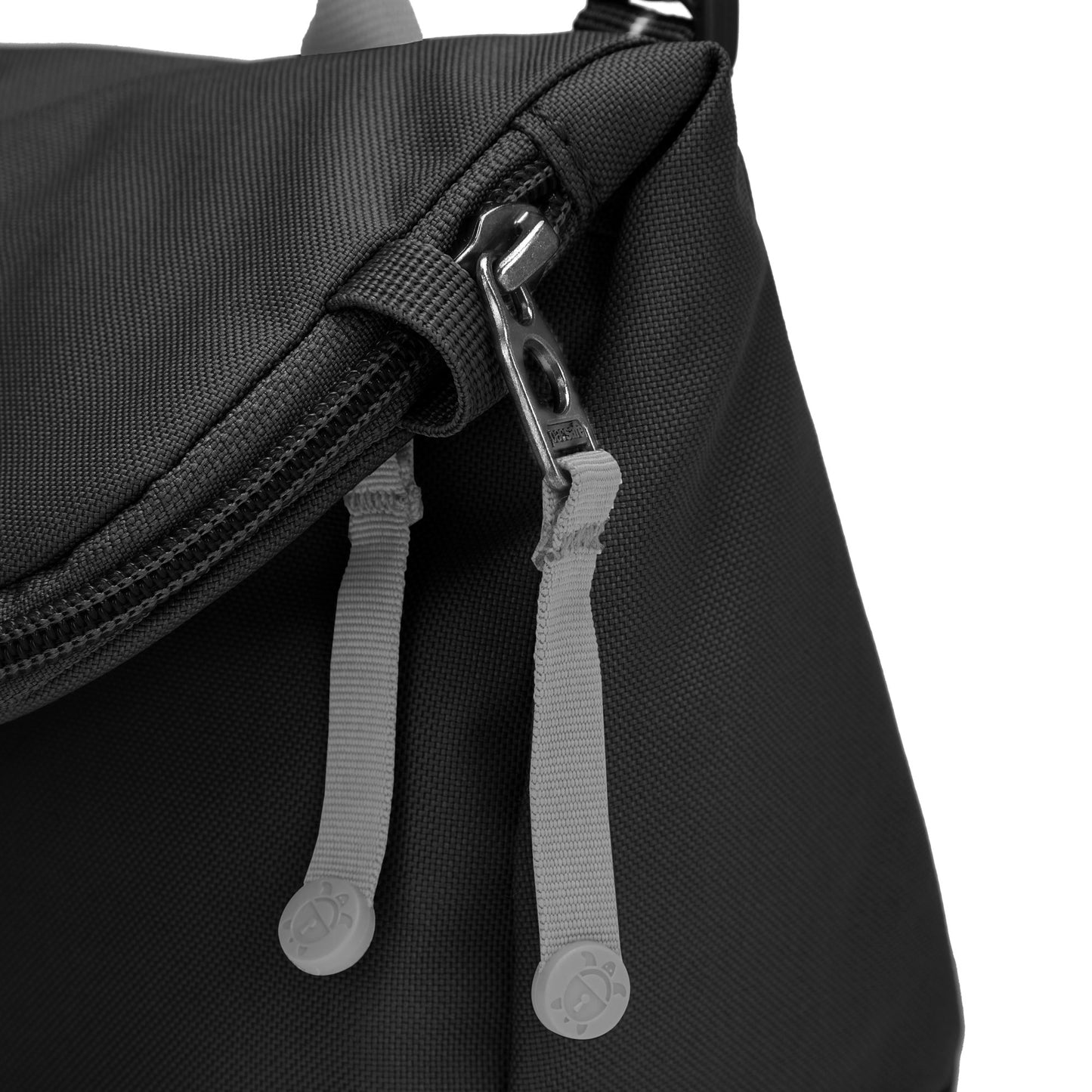 Close-up of the Pacsafe® GO Anti-Theft Saddle Crossbody bag in black with gray zipper pulls and silver zipper.