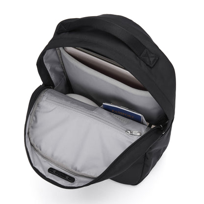 Open Pacsafe® V 20L Anti-theft City Backpack with padded laptop sleeve, water bottle, and passport inside.