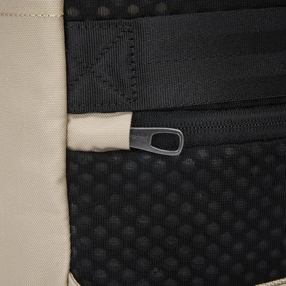Close-up of black zipper on recycled polyester, part of Pacsafe® V 20L City Backpack's padded laptop sleeve.