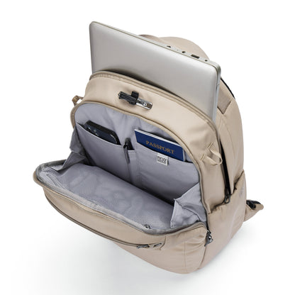 Pacsafe® V 26L Anti-theft Tour Backpack in beige with open front pocket showing organized travel essentials.
