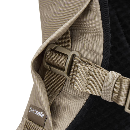 Close-up of a Pacsafe® V 26L Anti-theft Tour Backpack strap with plastic buckle and visible stitching.