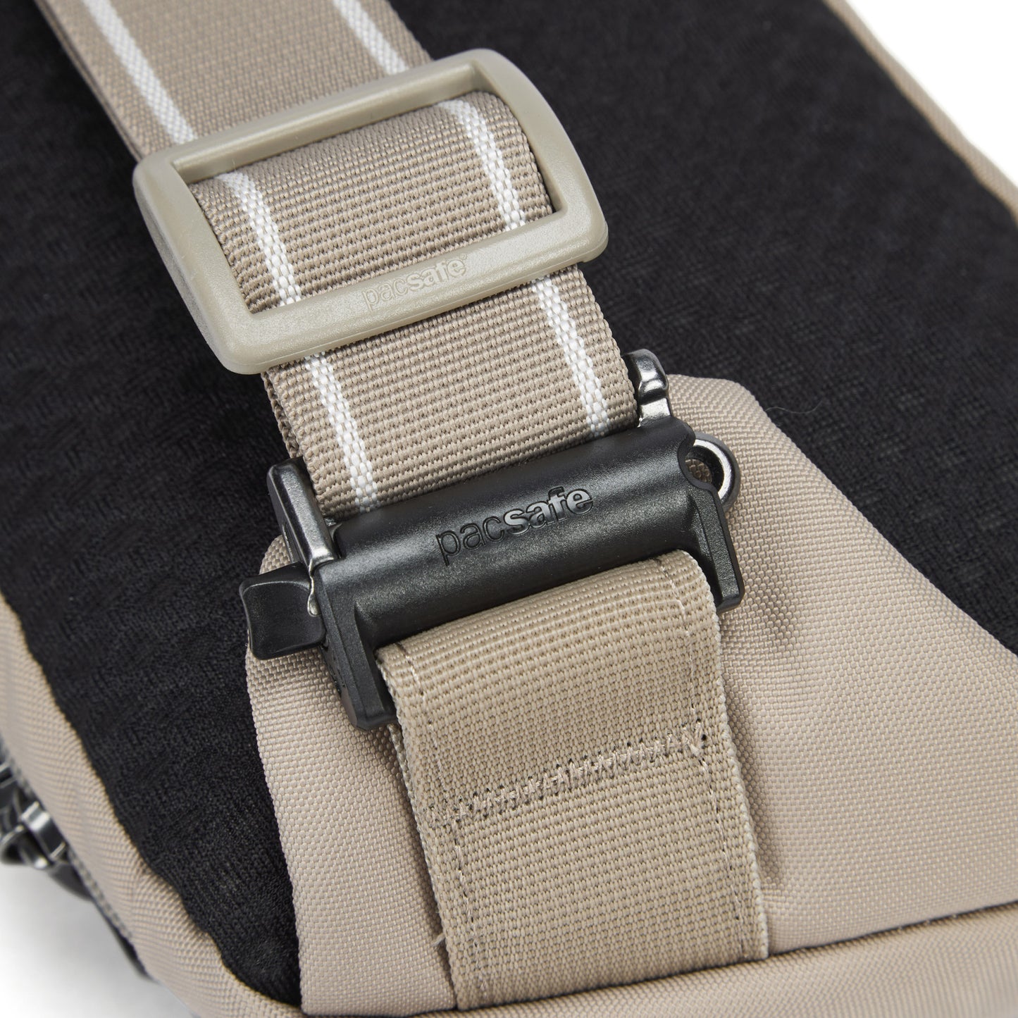 Close up of adjustable beige sling strap.