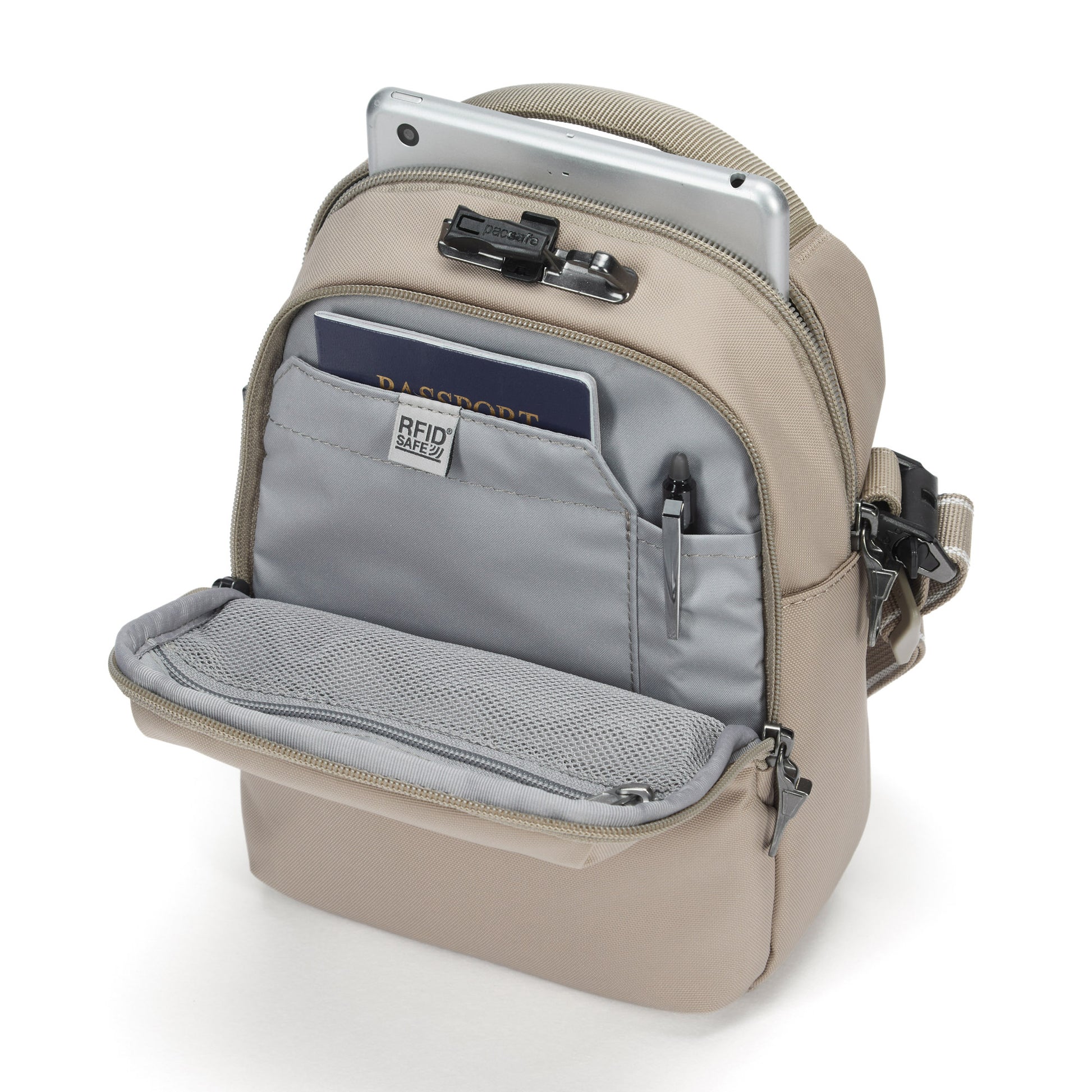The Pacsafe® V Anti-theft Companion Crossbody by Pacsafe is a small beige bag with an open pocket for essentials.