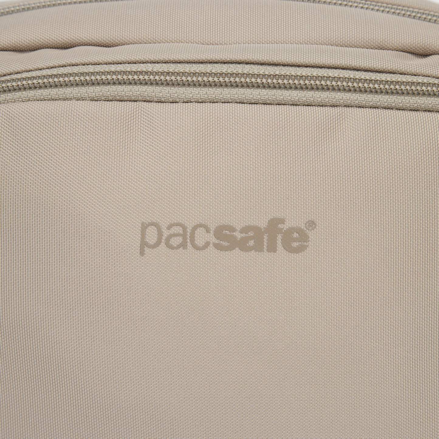 Close up of beige logo on beige hip pack.