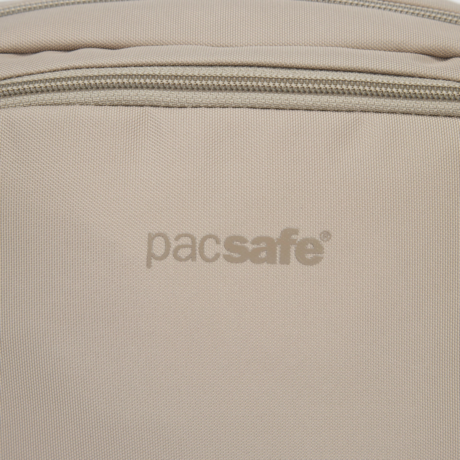 Close up of beige logo on beige hip pack.