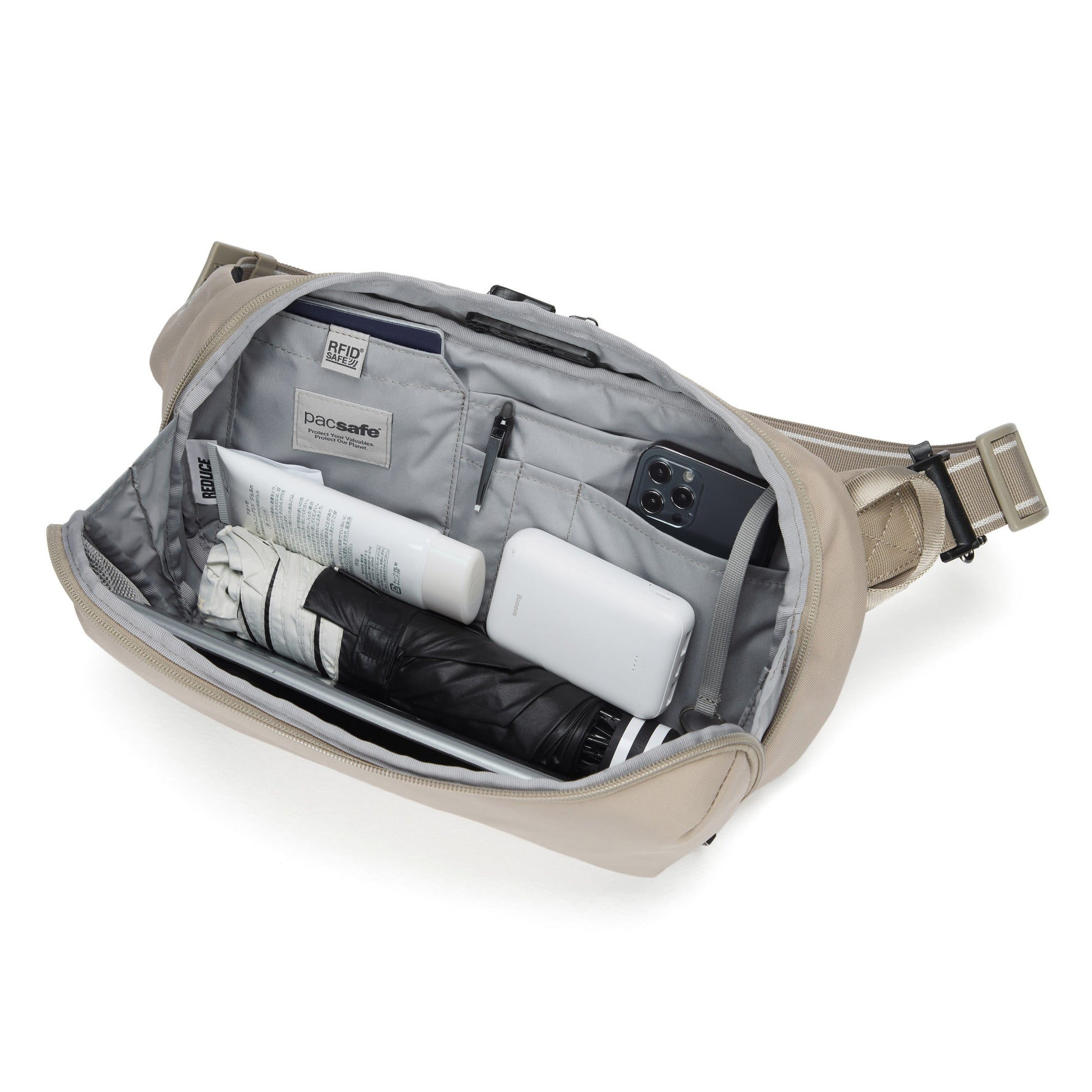 The Pacsafe® V Anti-theft Urban Sling by Pacsafe keeps phone, umbrella, lotion & more organized in beige style.