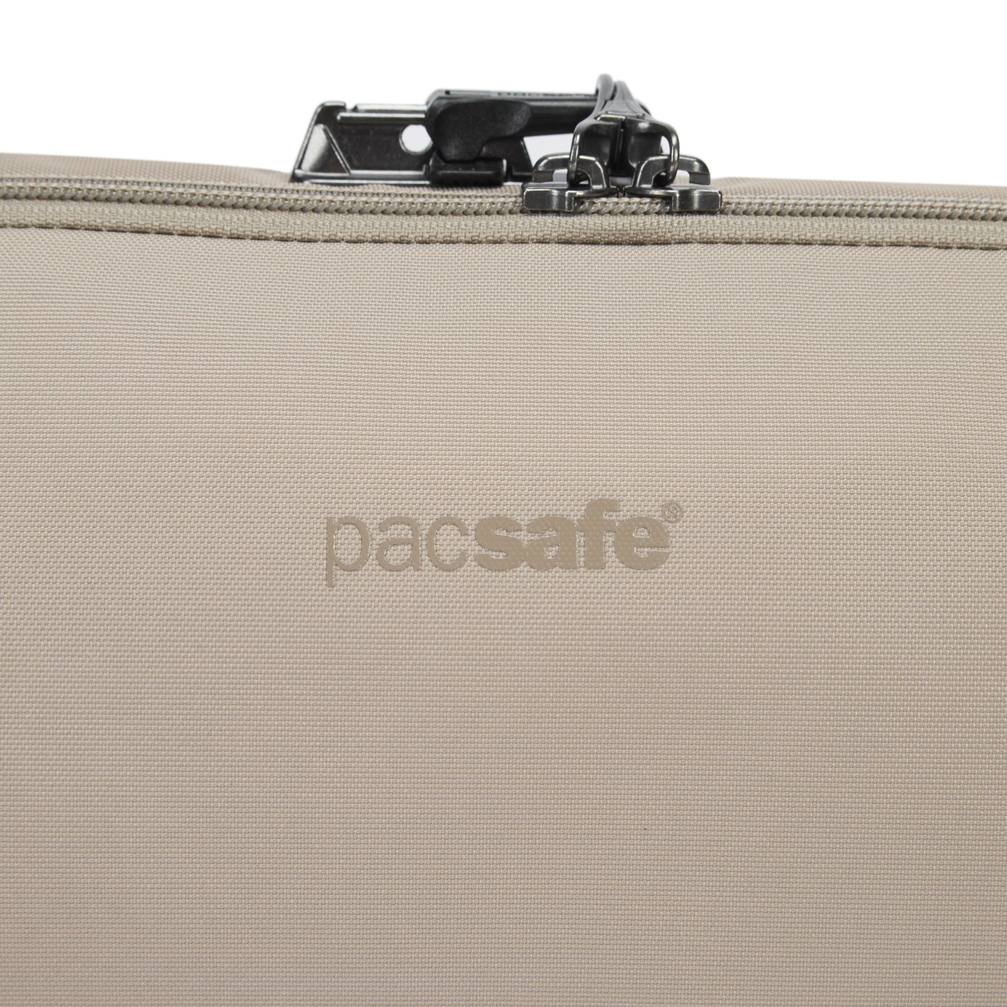 Close-up of Pacsafe® V Anti-theft Urban Sling in beige, showing top zipper and lock.
