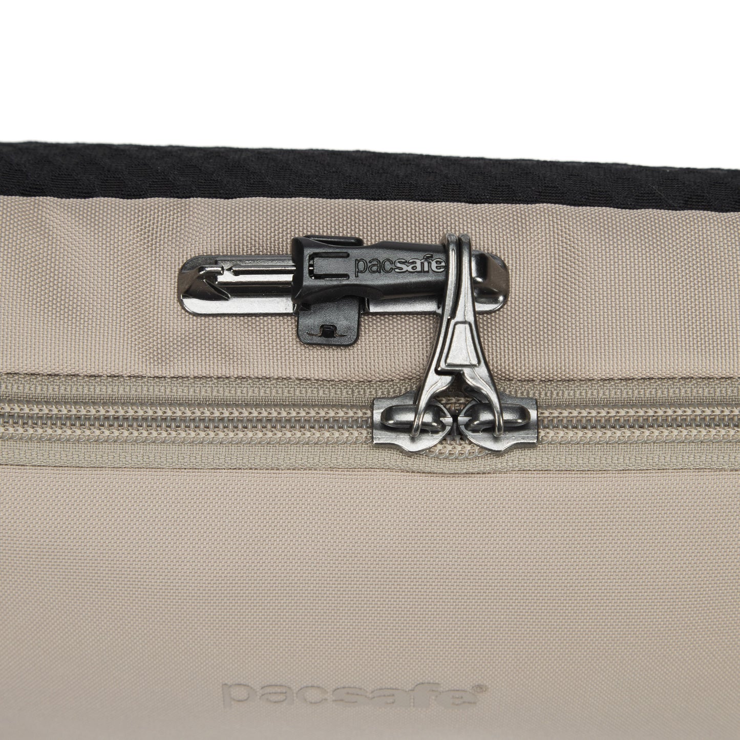 Close-up of the Pacsafe® V Anti-theft Urban Sling in beige, featuring dual zippers with a built-in lock.
