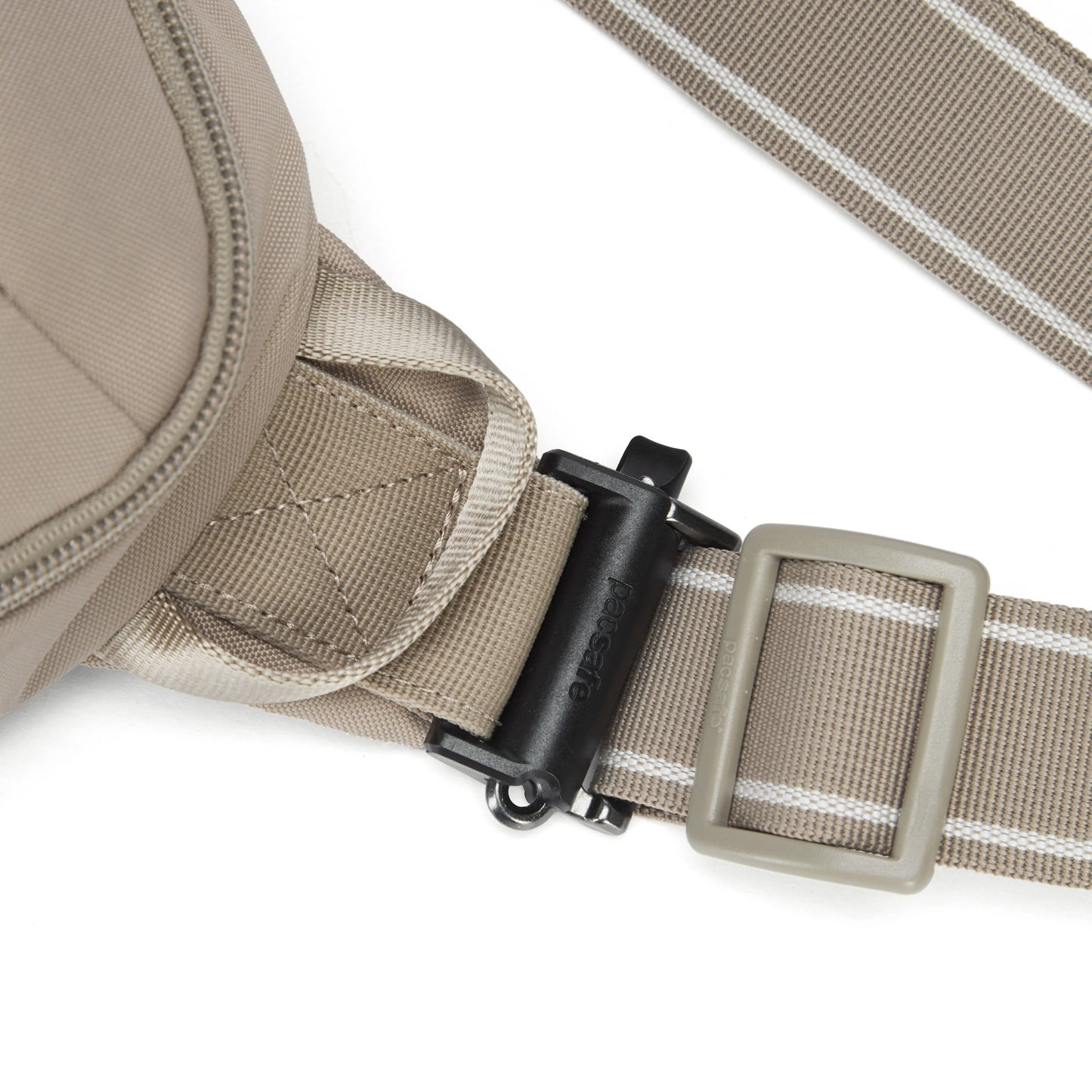Close-up of Pacsafe® V Anti-theft Urban Sling's beige recycled strap with black buckle and slider, by Pacsafe.