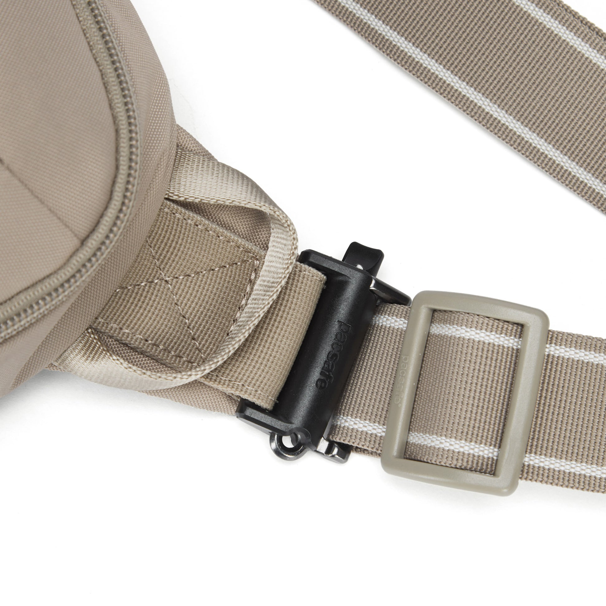 Close-up of Pacsafe® V Anti-theft Urban Sling's beige recycled strap with black buckle and slider, by Pacsafe.