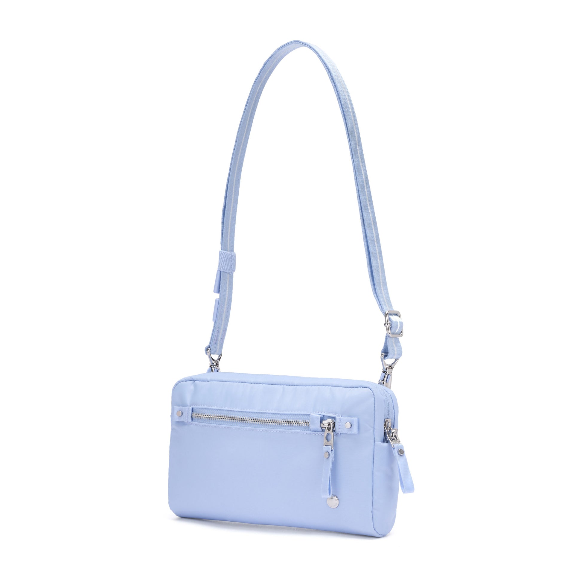 Pacsafe® W Anti-theft 3-in-1 Sling by Pacsafe in light blue, recycled polyester, with zipper pocket and adjustable strap.