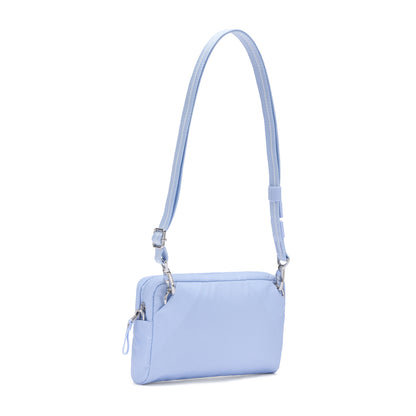 The Pacsafe® W Anti-theft 3-in-1 Sling by Pacsafe is a light blue recycled polyester crossbody with silver hardware.