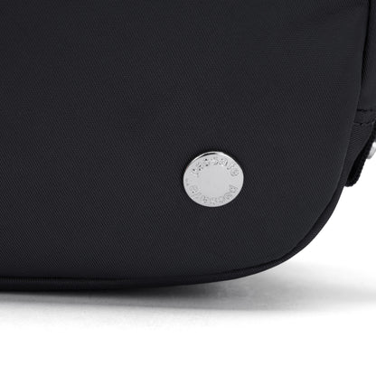 Close-up of the Pacsafe® W Anti-theft Micro Sling in black with a round silver Pacsafe logo badge near the bottom.