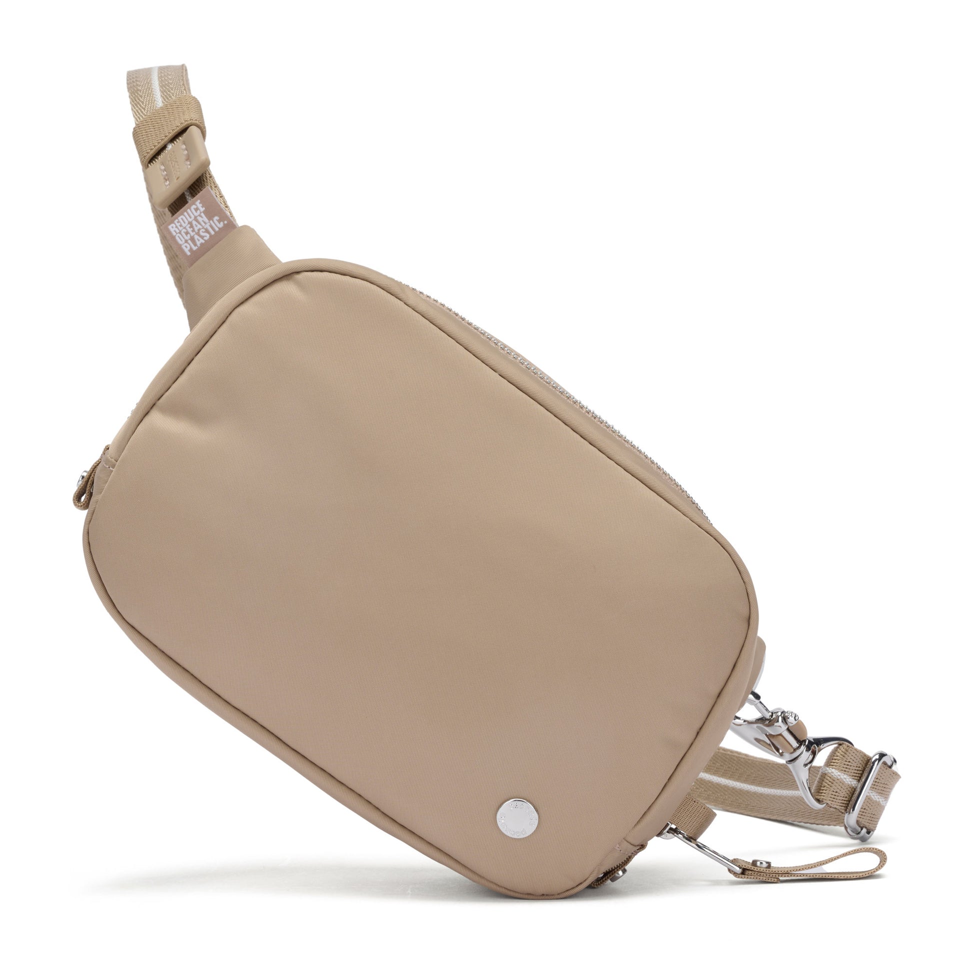 The Pacsafe® W Anti-theft Micro Sling by Pacsafe is beige, recycled polyester, with adjustable straps and metal logo.