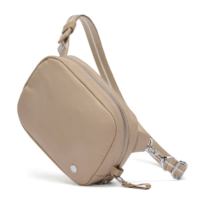 Pacsafe® W Anti-theft Micro Sling by Pacsafe: beige recycled-polyester bag with zip and adjustable strap.