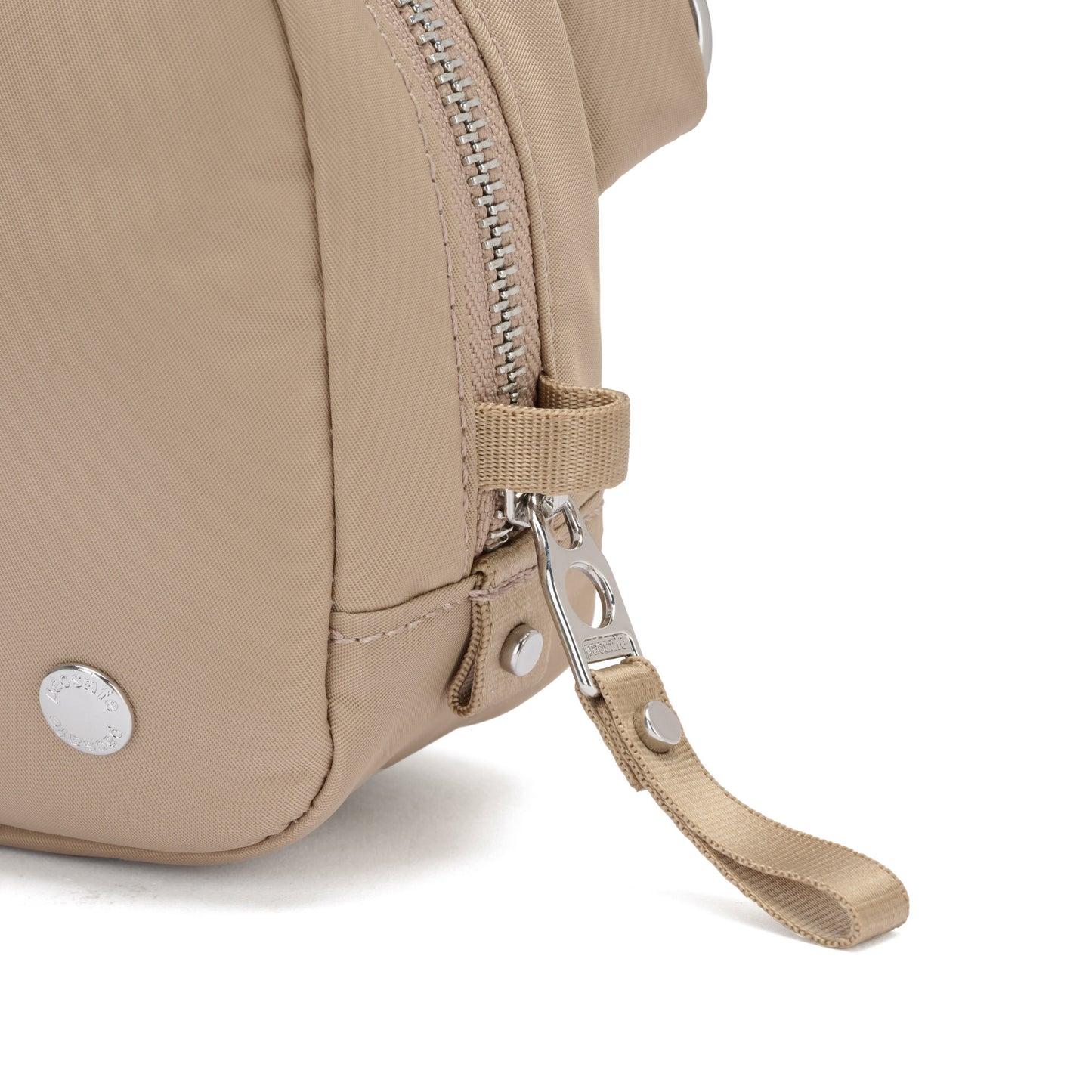 Close-up of the Pacsafe® W Anti-theft Micro Sling in beige recycled polyester, with a zip and fabric pull tab.