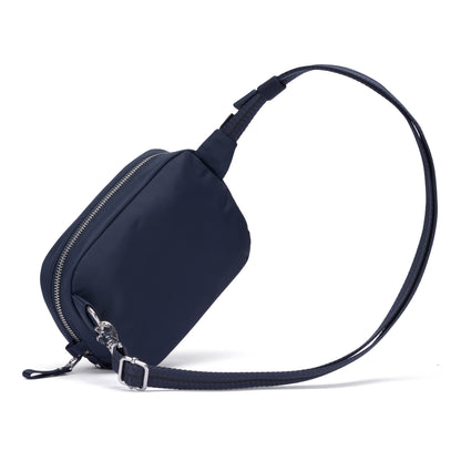 Pacsafe® W Anti-theft Micro Sling in navy blue recycled polyester with adjustable strap and silver zipper.