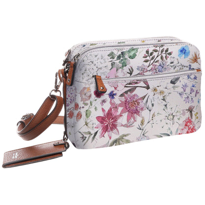 Seven Days Darby RFID Crossbody: white floral bag with brown strap and front zipper pocket for security.