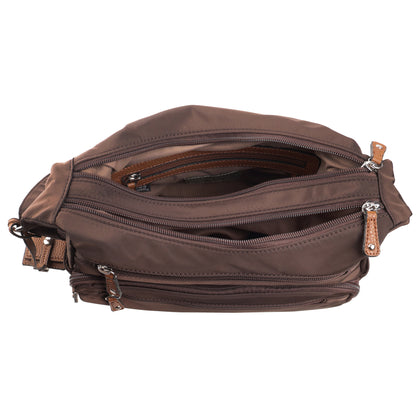 Seven Days Monkey Puzzle nylon crossbody bag with adjustable strap and zippered compartments, shown open.