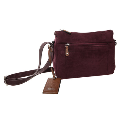 Seven Days Black Ash faux suede crossbody with front zip pocket, adjustable strap, and attached luggage tag.