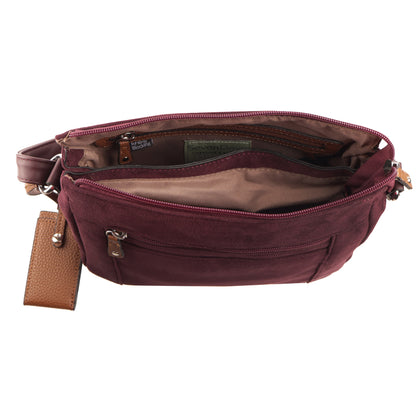 Seven Days Black Ash crossbody in faux suede with tan interior, zip pocket, and brown leather keychain.